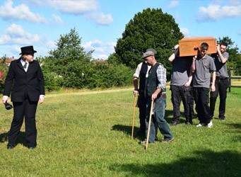 Steve Soult Limited Artiste coffin being carried by community residents for Brinsley Coffin Walk 2015